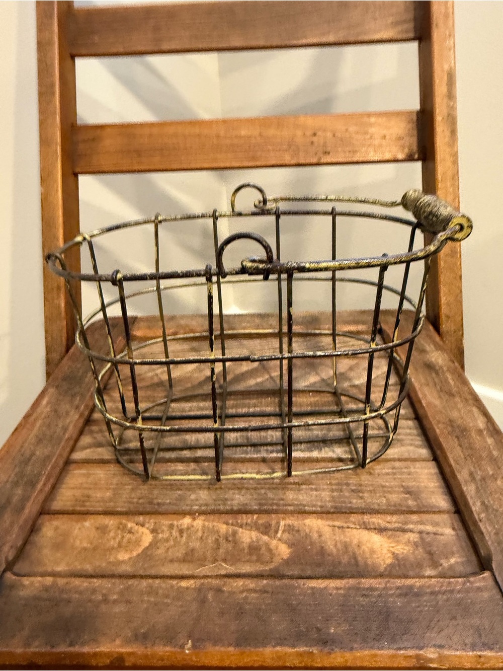 Vintage wire basket with wrapped wire handle, rustic/aged finish